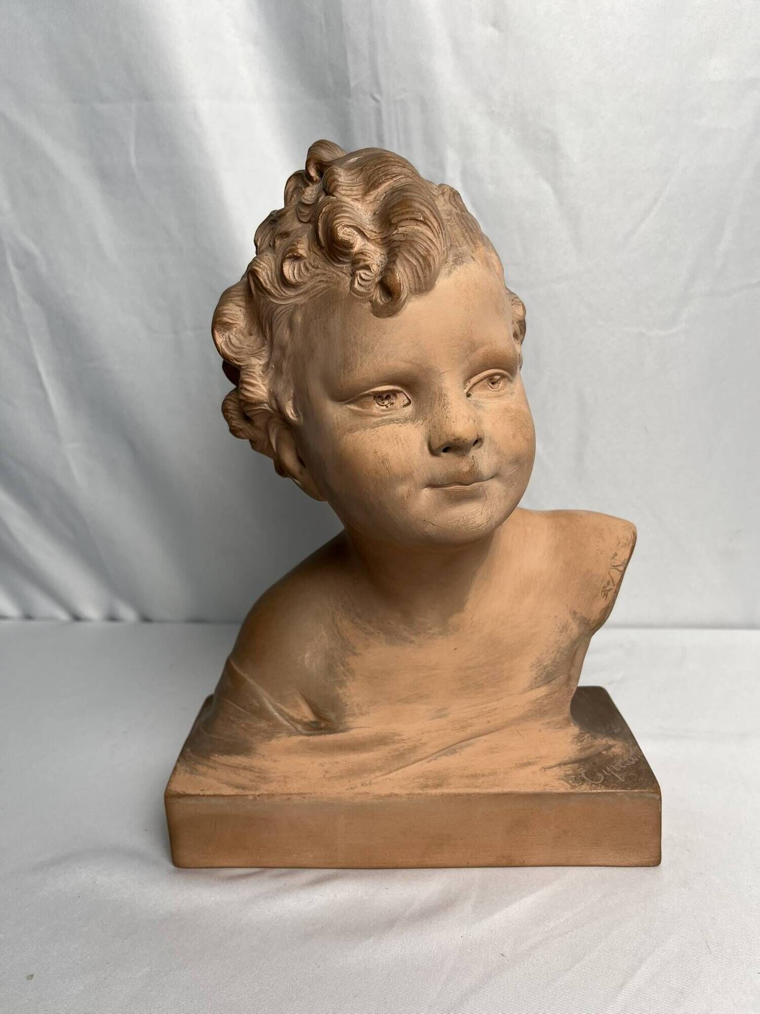 Cipriani, child bust in terracotta art signed 20th century