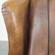 Sheep leather wingback chair finished with black piping