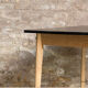 Vintage table in solid beech and black laminate tray