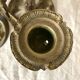 Pair of antique bronze candlesticks at the end of the table XIXth