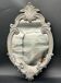Wall mirror – sculpted silver frame, with a golden reflection and a touch of green –