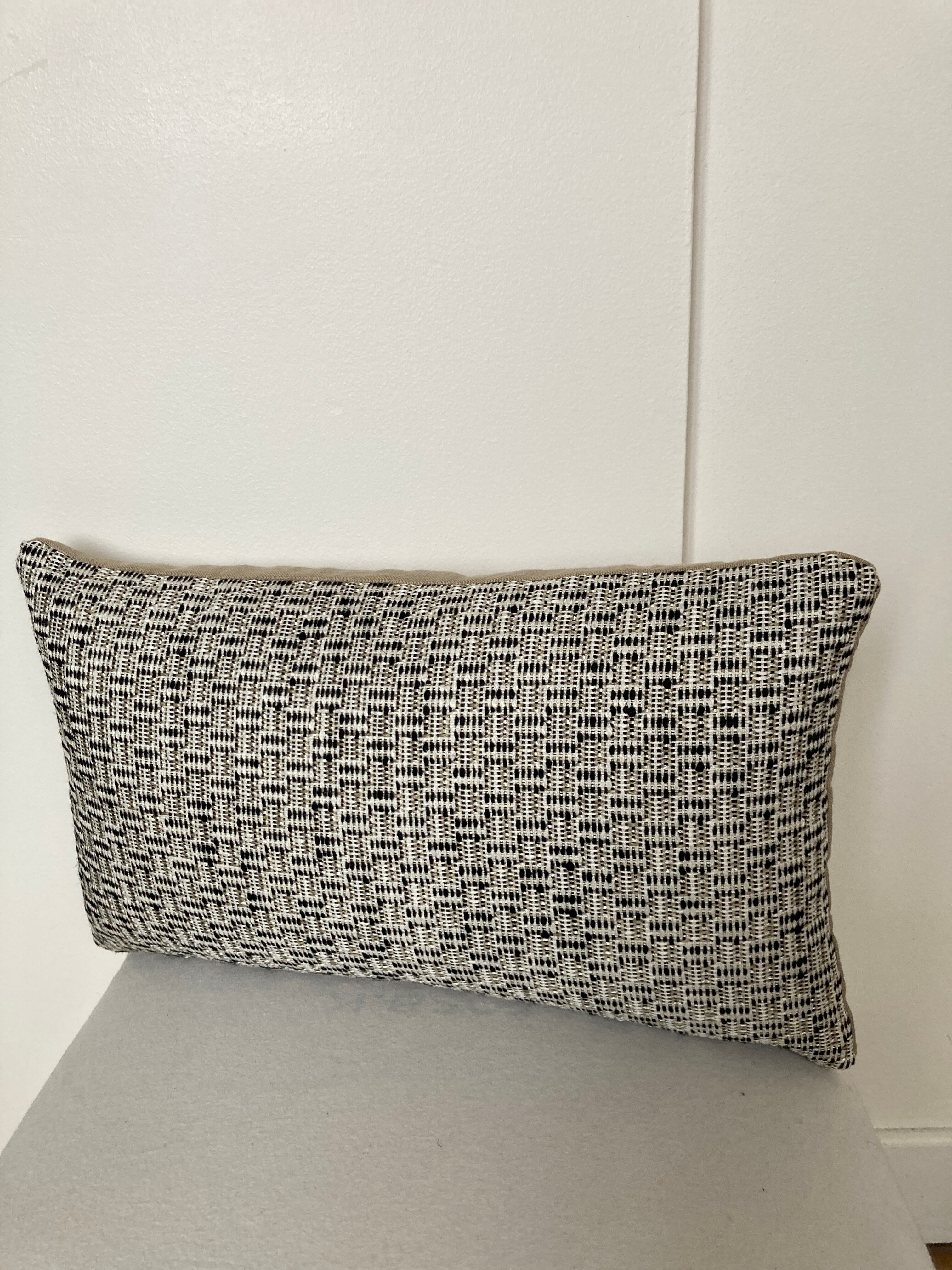 Bi-sided cushion beige black white pattern