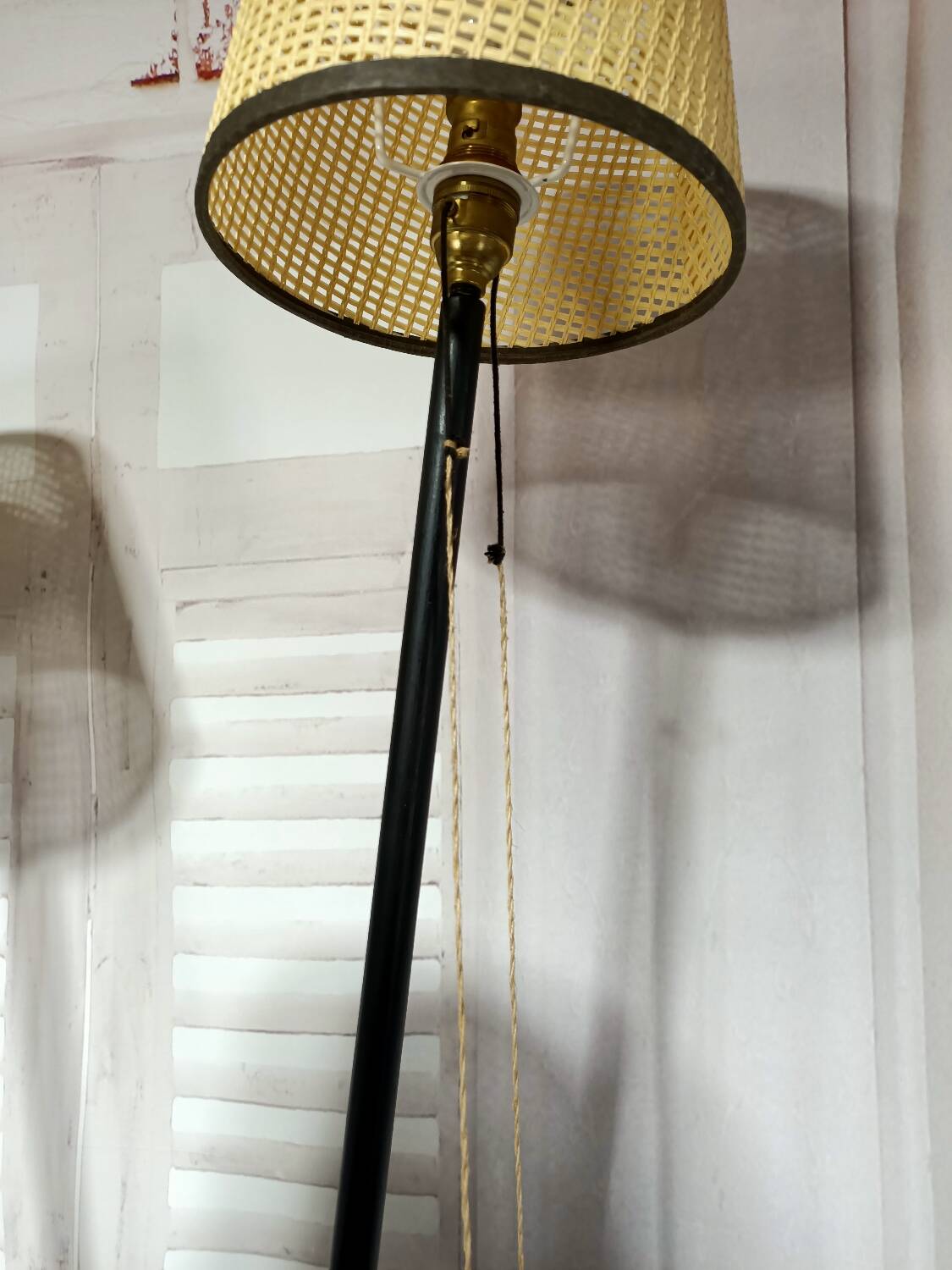 Mid-century tripod floor lamp with 3 lights and a yellow shelf.
