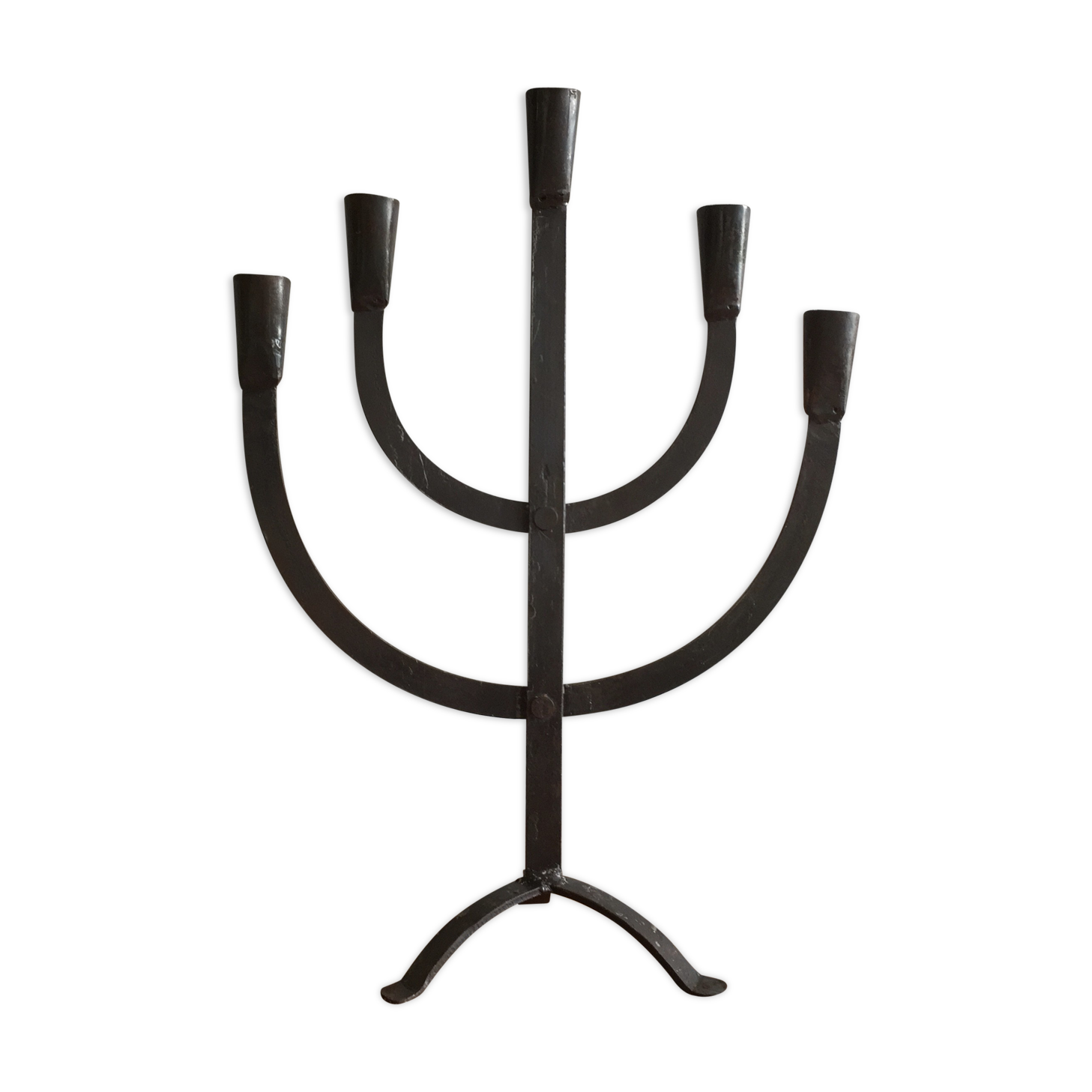 Old iron candelabra shaped high time