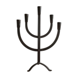 Old iron candelabra shaped high time