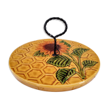 Vintage yellow earthenware cheese dish with sunflower decor and wrought iron handle
