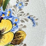 Decorative earthenware and pewter wall plate with spring flowers