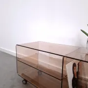 Vintage hifi, LP cabinet, TV unit made of tinted plexiglass on wheels, records.