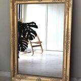 Wood and gilded stucco mirror, 19th century, 115 x 61.5 cm.