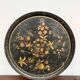 Round plateau, 19th century, painted black with fruit and grape decoration (49 cm)