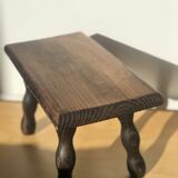 Small wooden bench with beaded legs