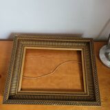 Frame with channels in wood and gilded stucco