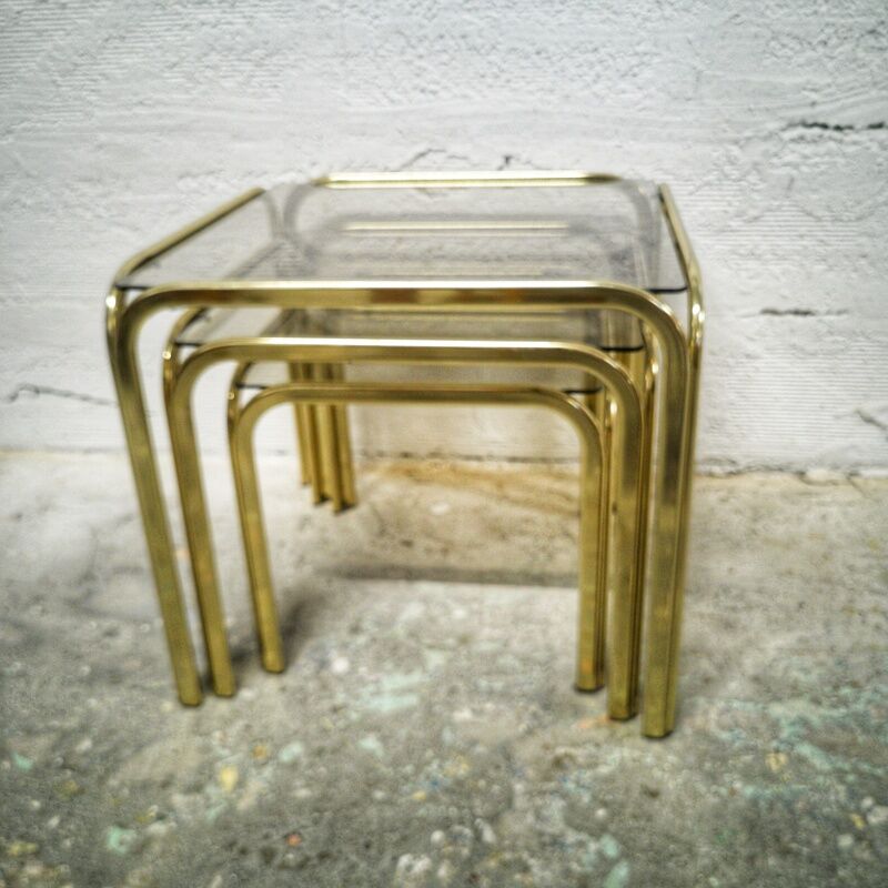 Trio of gilded metal trundle tables