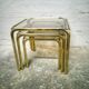 Trio of gilded metal trundle tables