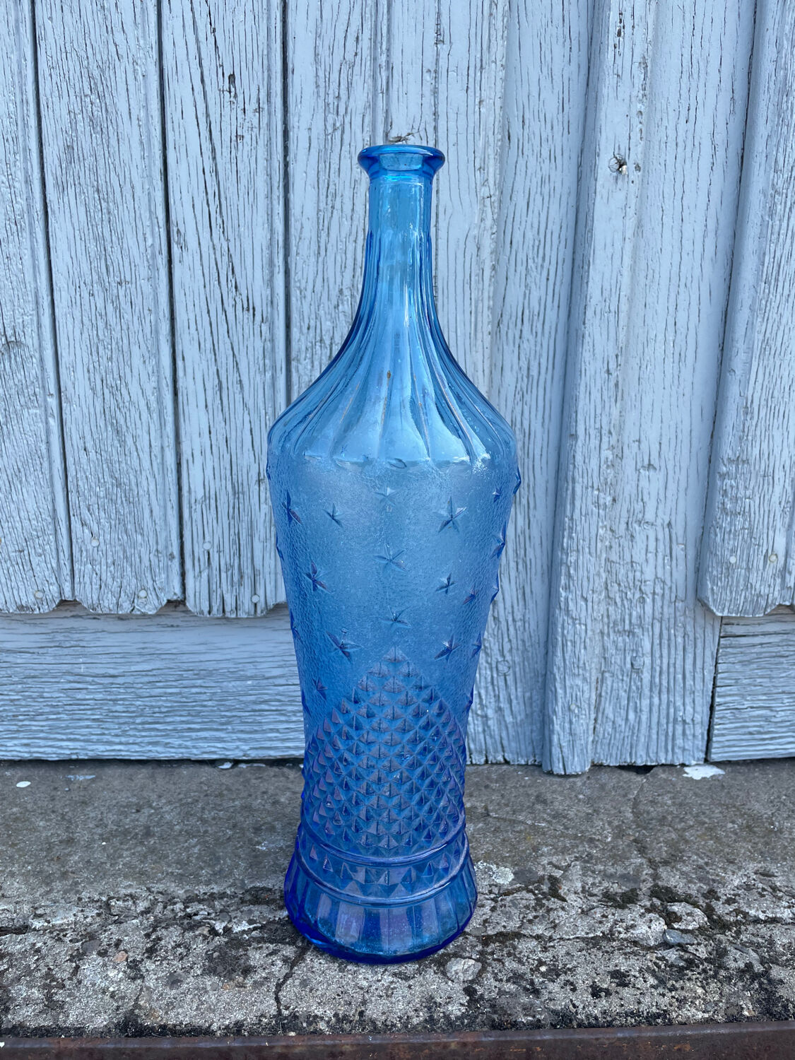 Blue glass decanter with a moon star motif