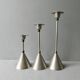3 bougeoirs en métal argenté et doré