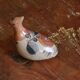 Ancient Mexican bird statue in ceramic
