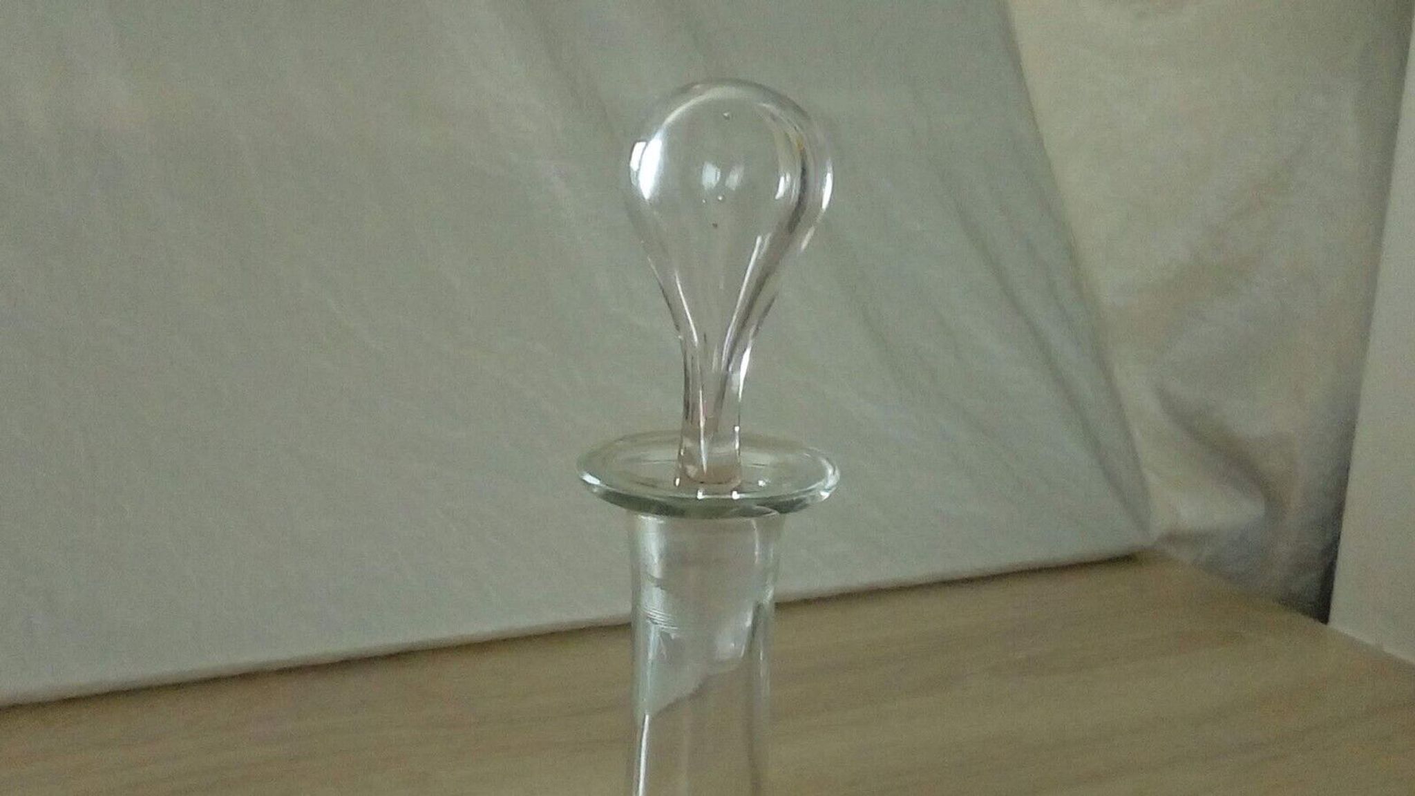 Glass carafe with enamel decoration of cherries.