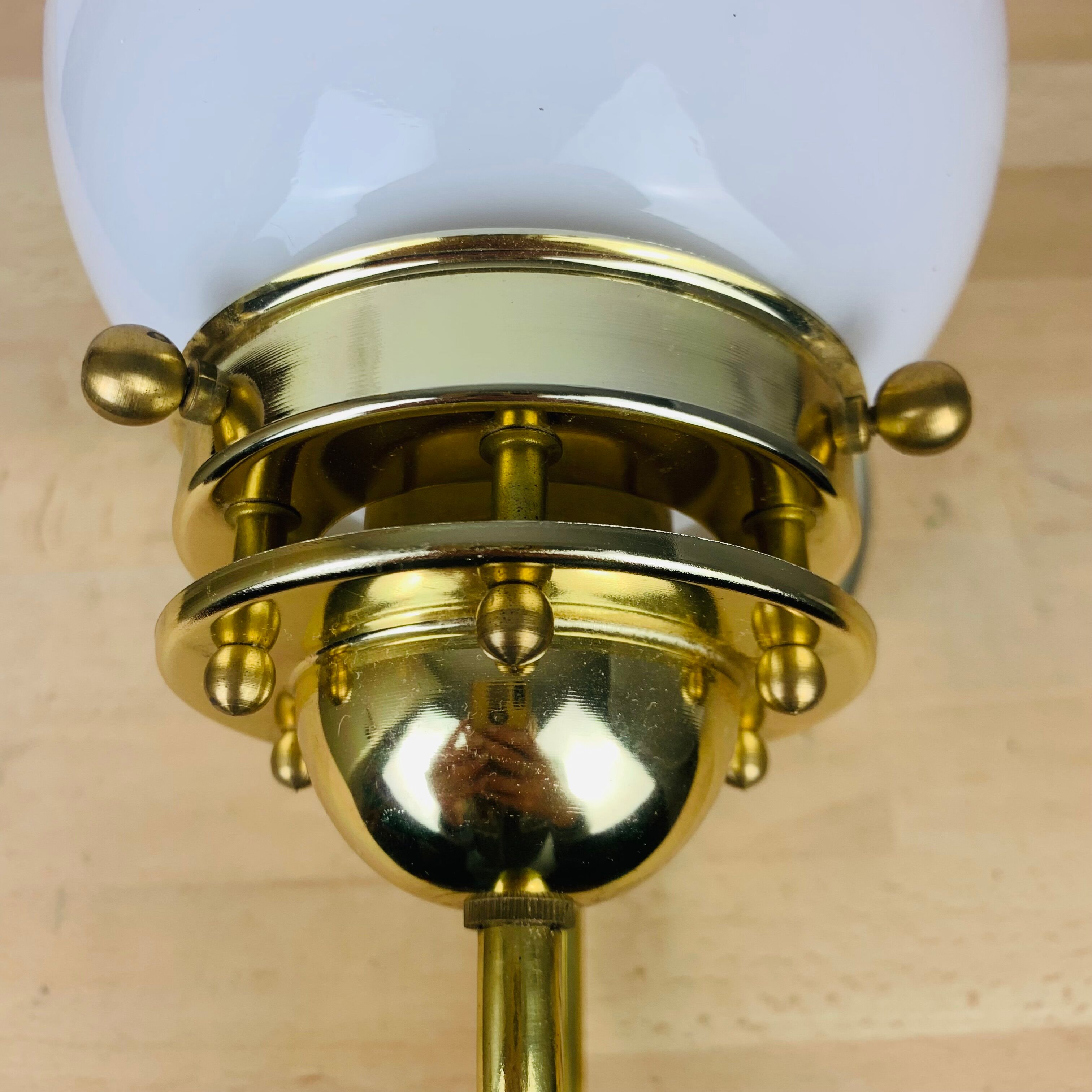 Brass wall lamp and opaline globe