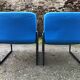 Electric blue fabric designer armchairs with black lacquered metal legs from the 80s.