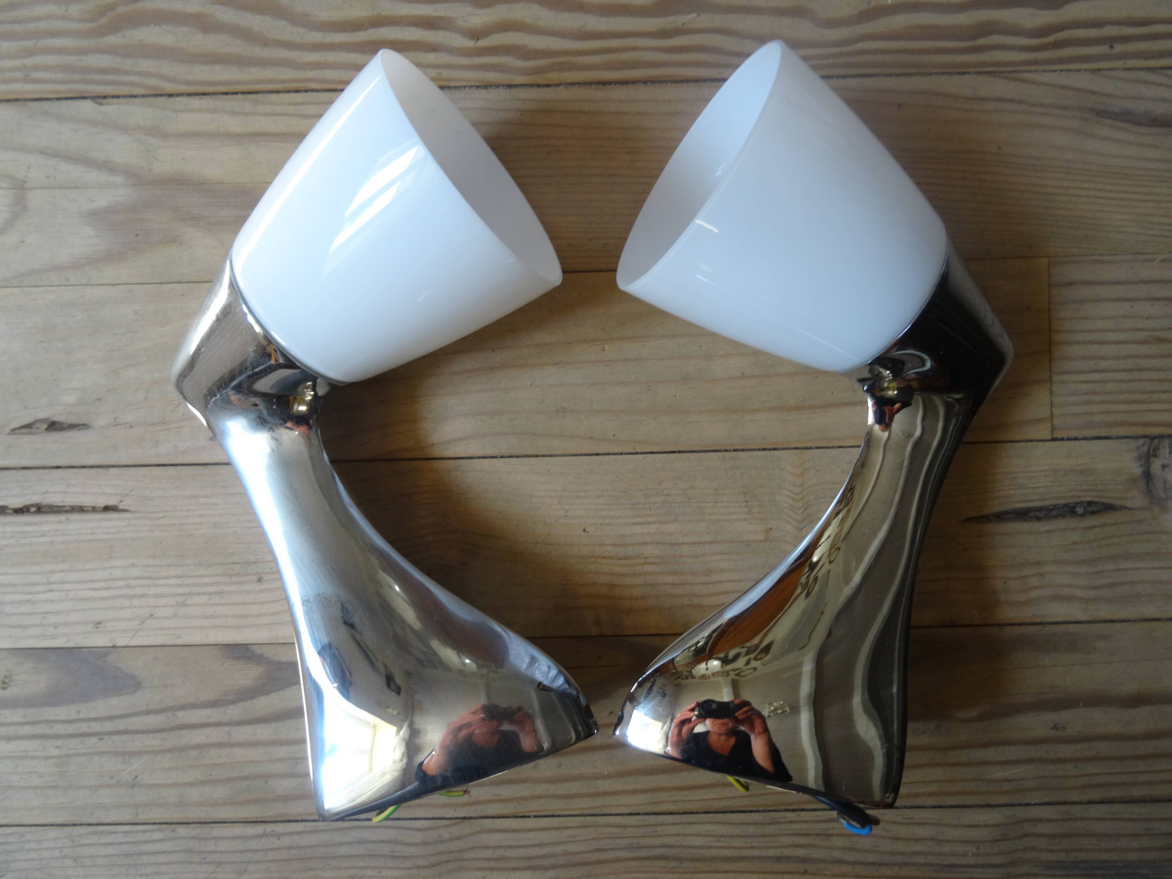 Pair of stainless steel and opaline wall lamps