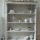 Bookcase in pearl grey waxed finish, light oak waxed top.