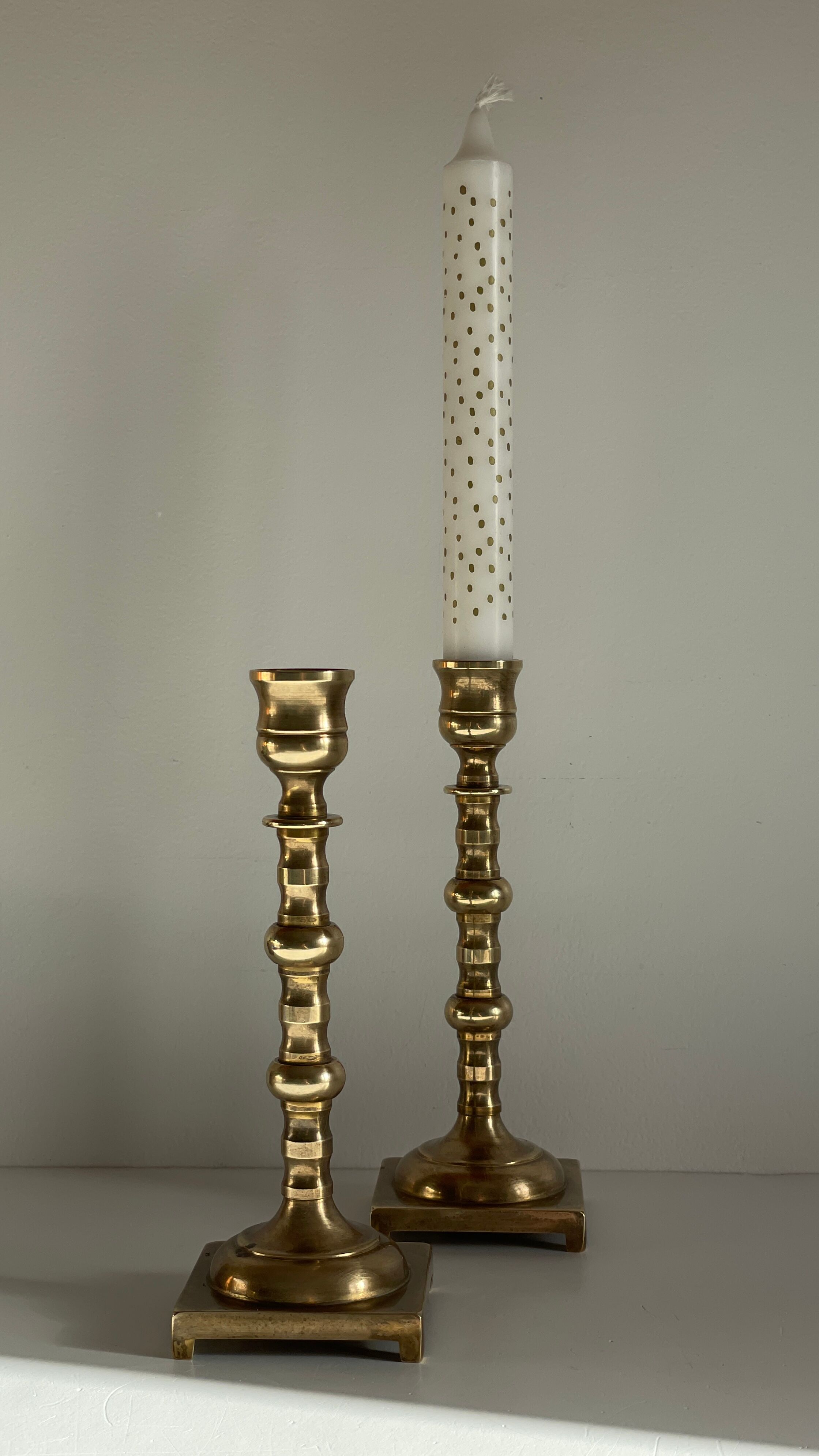 Pair of brass candle holders made in England