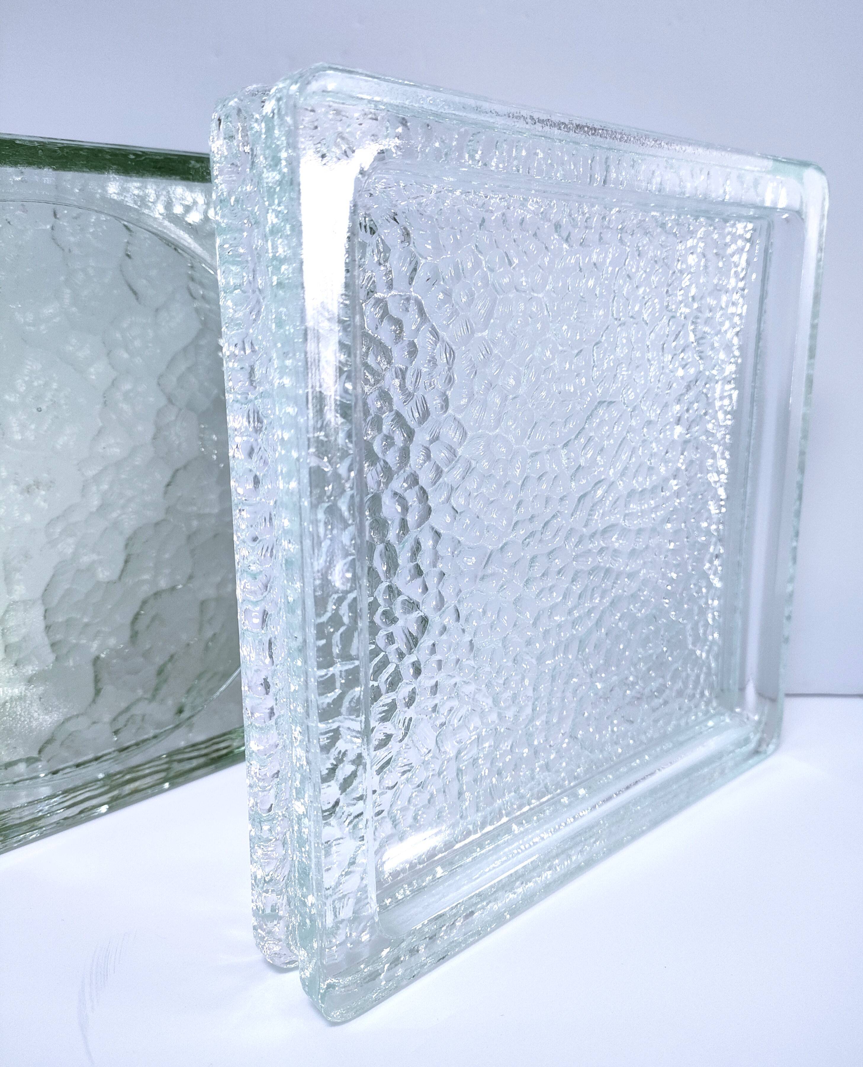 Two designer glass paving pockets
