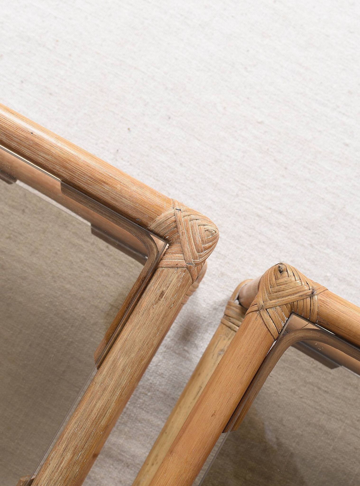 Pair of bedside tables or side tables, in rattan and smoked glass