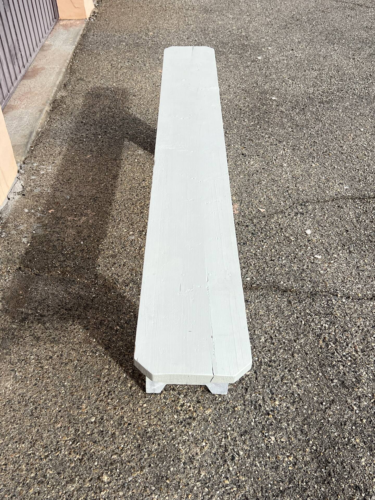 Pair of wooden benches painted white, French artisanal work.