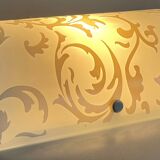 Polished and screen-printed glass sconce by eglo