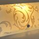 Polished and screen-printed glass sconce by eglo