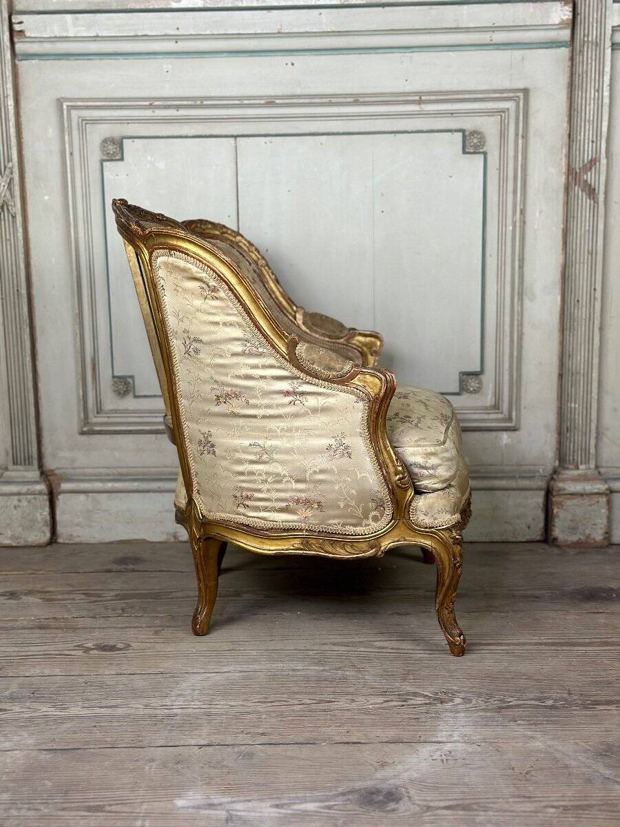 A Louis XV style child's bergère chair in carved and gilded wood, circa 1880