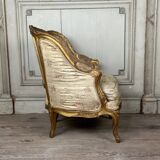A Louis XV style child's bergère chair in carved and gilded wood, circa 1880