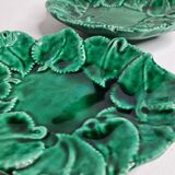 Set of three enamelled, emerald green, leaf-decorated faent cups