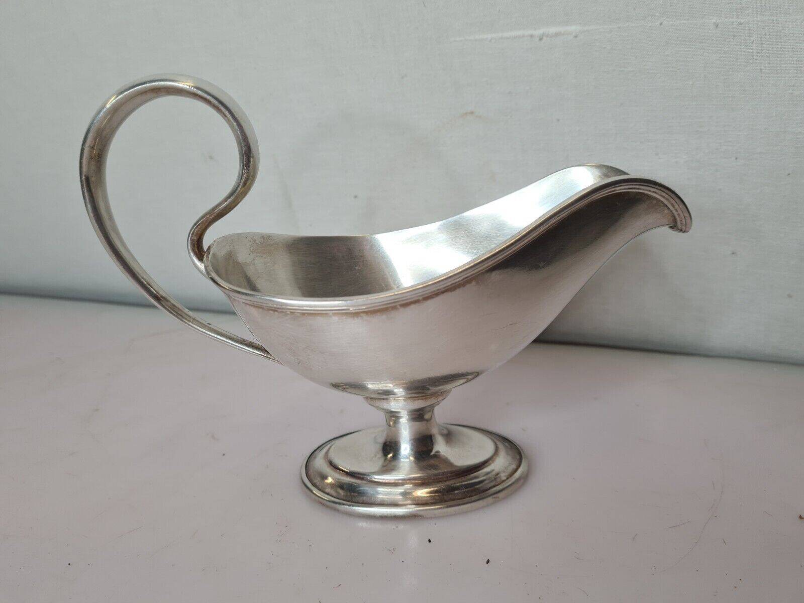 silver metal gravy boat