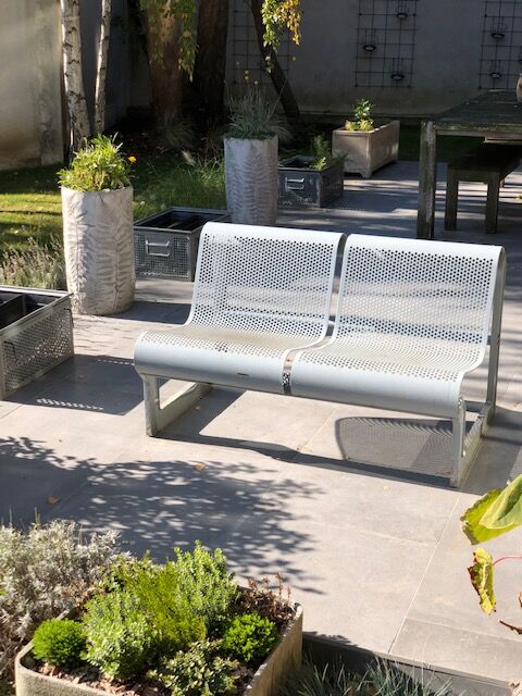 Perforated metal garden bench