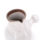 Minimalist white ceramic pitcher signed Pierlot, 1960s