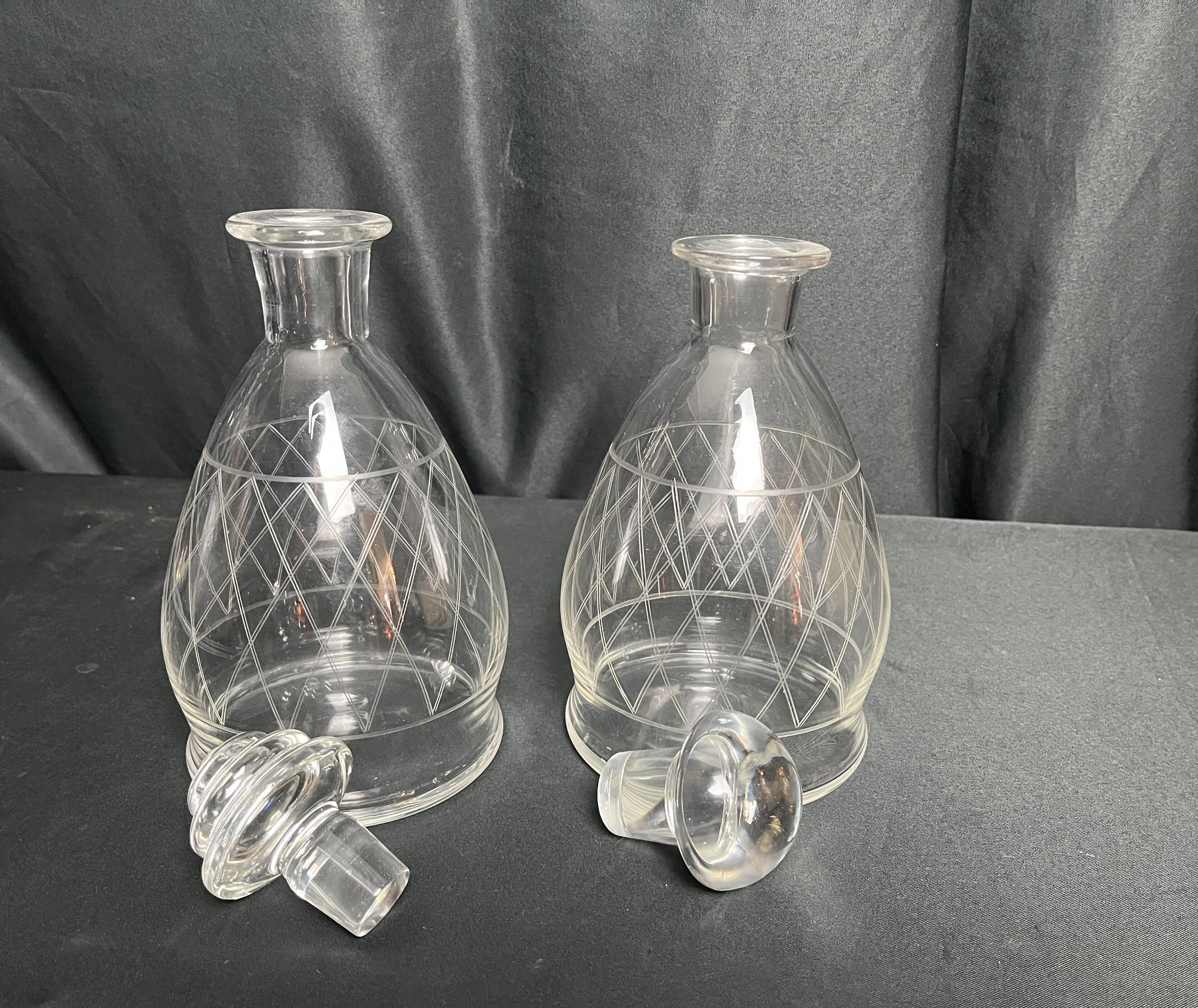 Tableware, two engraved crystal carafes with stoppers from around 1940.