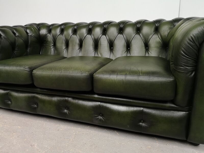 Three-seater green leather Chesterfield sofa