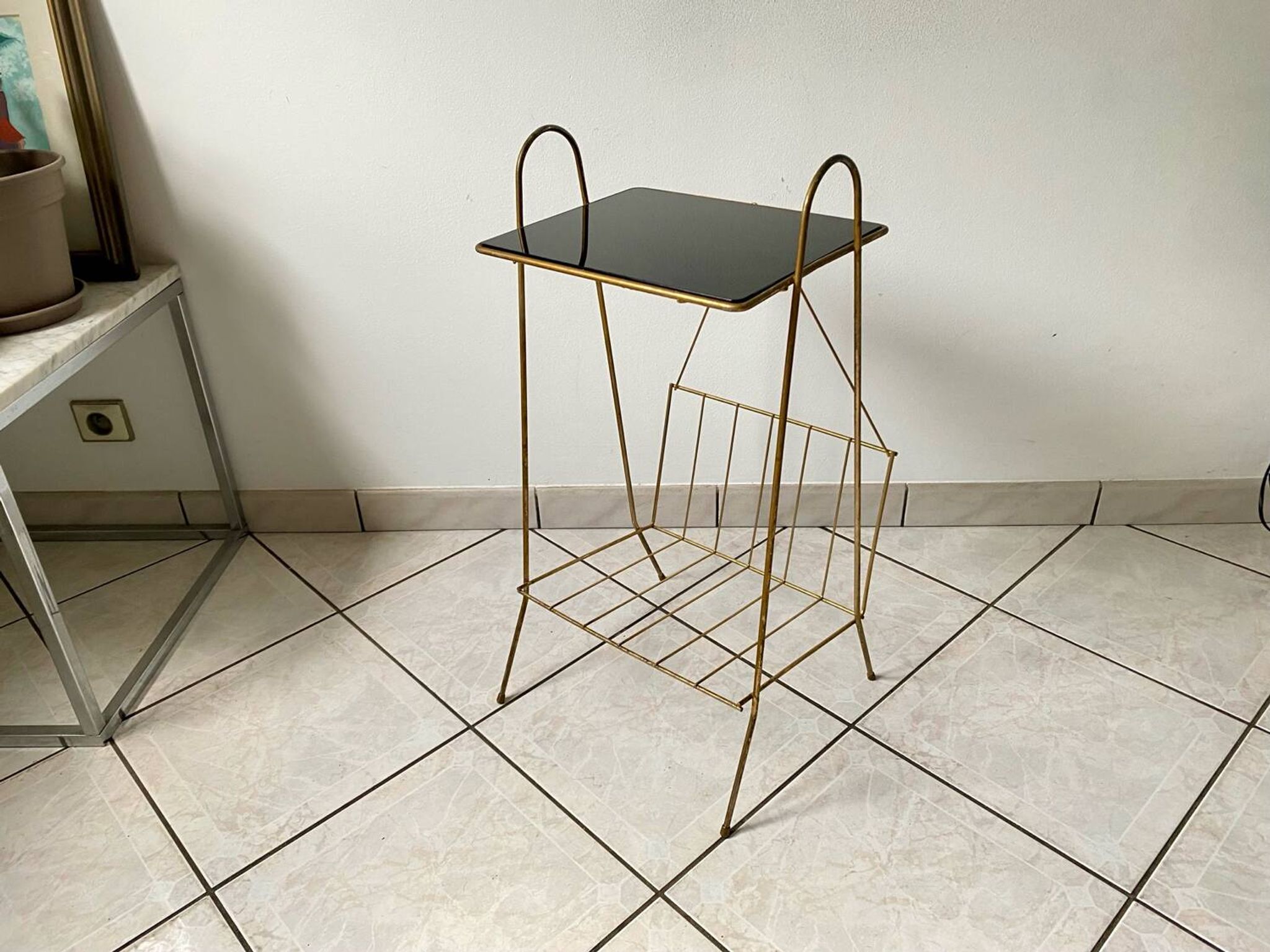 Vintage 1960s brass and smoked glass side table with magazine holder.