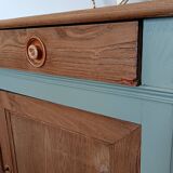 Buffet made of natural wood and bronze green.