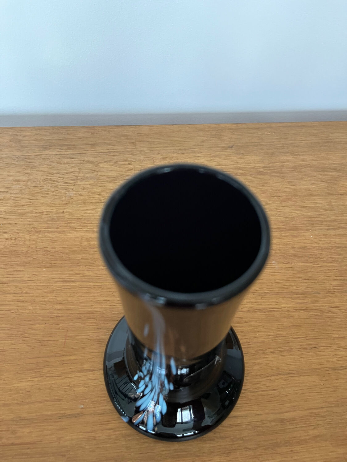 Artisanal vase in black glass with copper and blue inclusions.