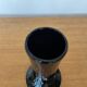 Artisanal vase in black glass with copper and blue inclusions.