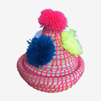 Wicker basket with lid and pom poms