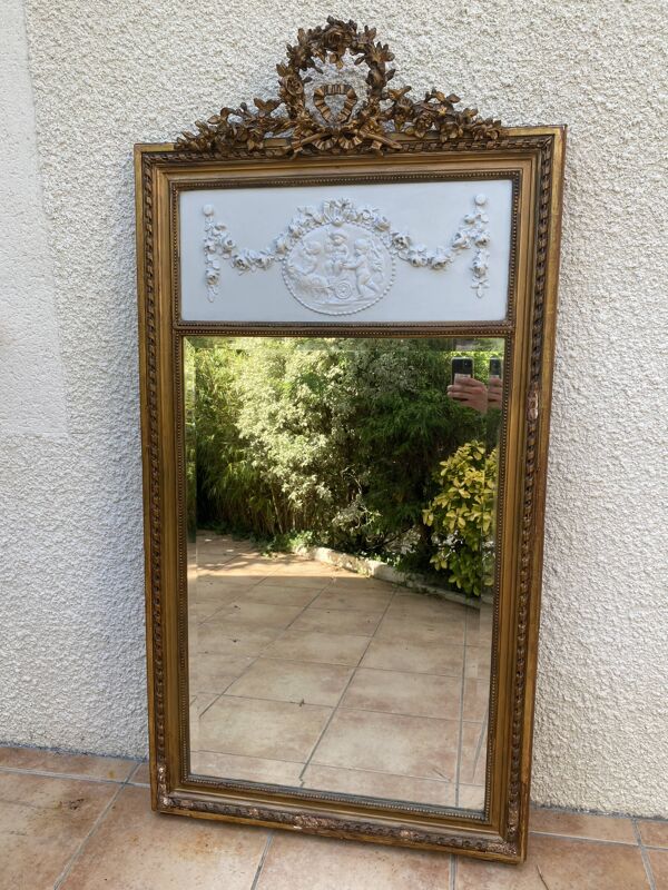 Miroir XIXème style Louis XVI en bois doré à la feuille d'or, 74x150cm