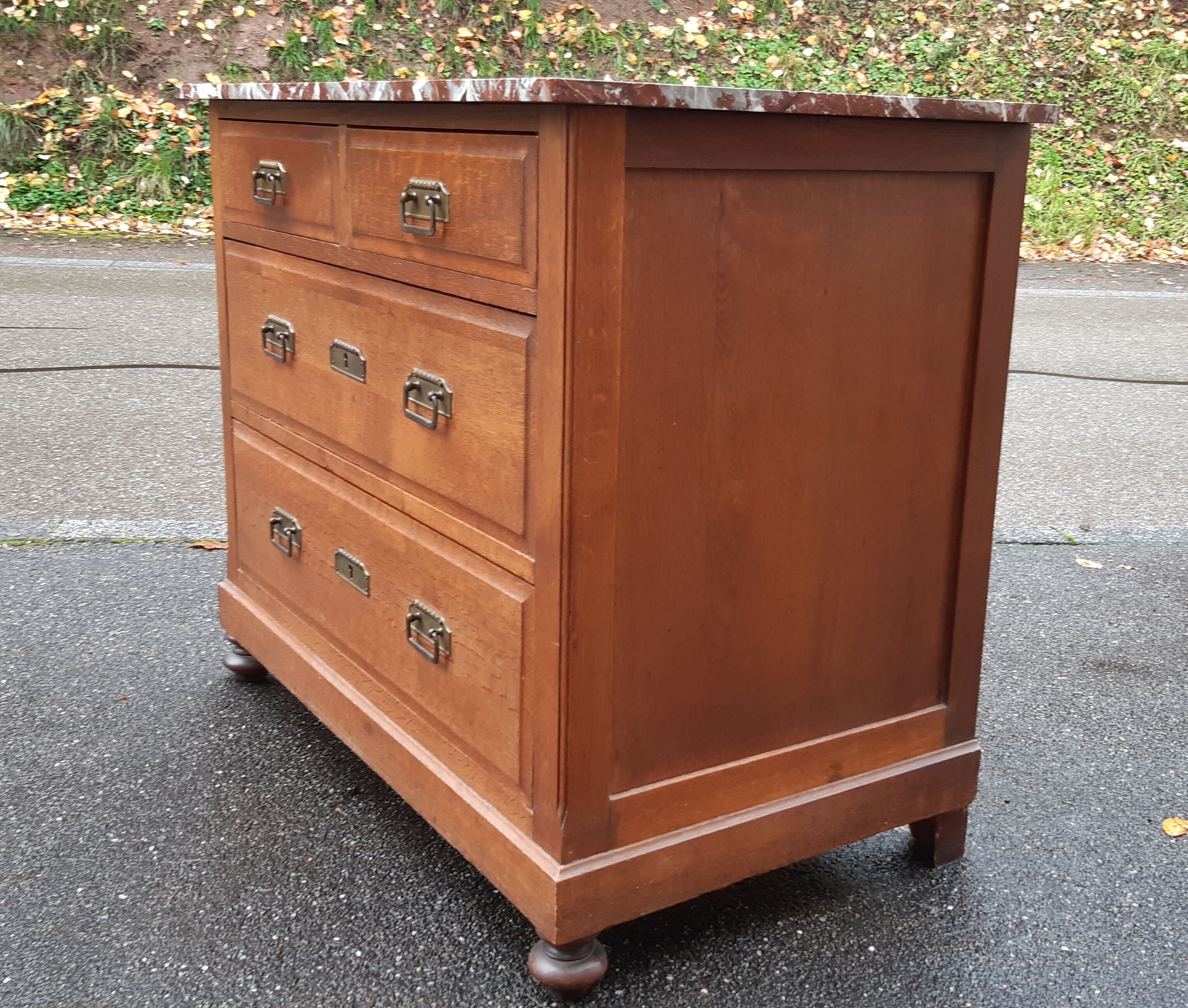 Oak chest of drawers and art deco marble.