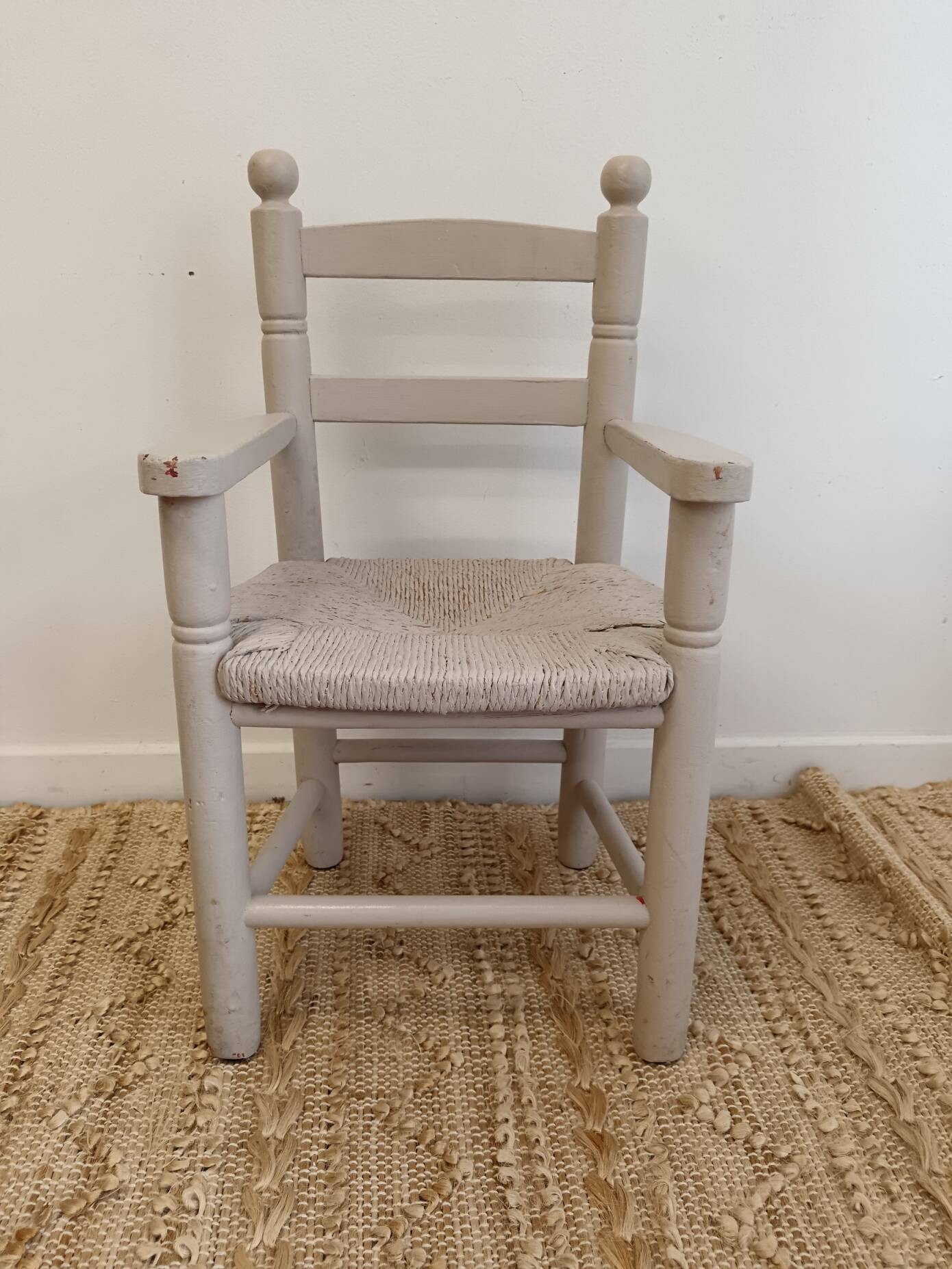 Grey patinated children's armchair with straw seat