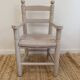 Grey patinated children's armchair with straw seat