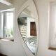 Dismantled Space Age XXL wall mirror in lacquered wood. France, 1970s.